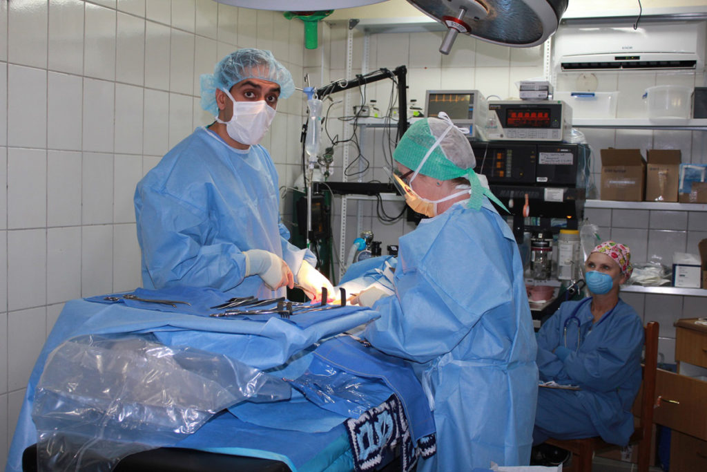 Dr .Chadal Performing an Umbilical Hernia Repair while Dr. Gvildys